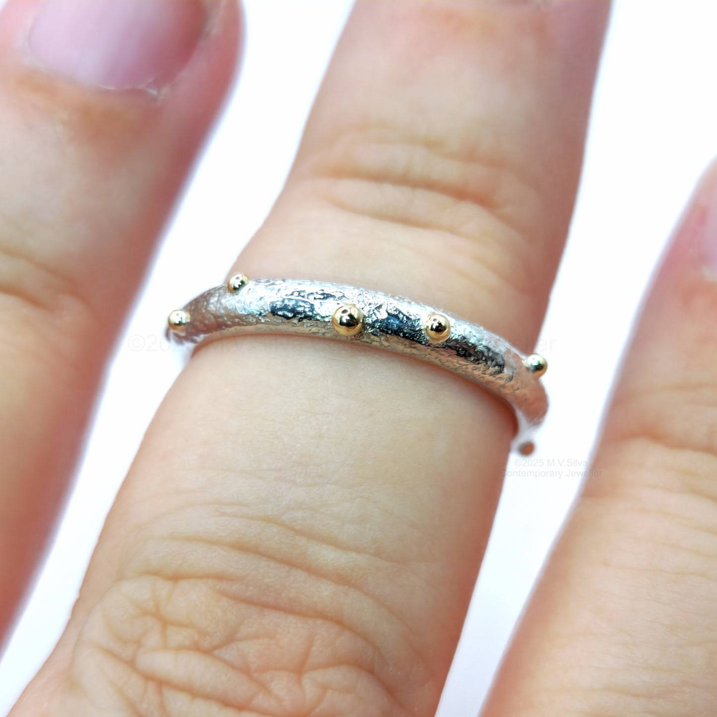 "Satellites" reticulated wedding ring with gold accents